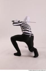 Man Adult Athletic Another Fighting with sword Kneeling poses Casual